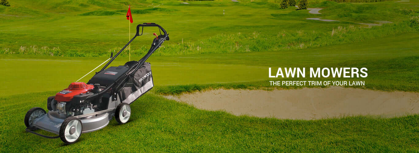 Honda HRJ 216 K3 TW lawn mower on green lawn, showcasing efficient cutting with professional landscaping features.